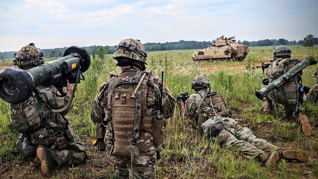 Soldiers assigned to Charlie Company, 2nd Platoon, 4th Battalion, 118th Infantry Regiment, 30th Armored Brigade Combat Team (ABCT), target a Bradley Fighting Vehicle during a company attack lane during the eXportable Combat Training Capability exercise at Fort Stewart, June 19, 2023.