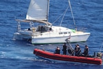 A Coast Guard cutter Legare and Tarpon rescued a 67-year-old man after his 37-foot sailing vessel became disabled 86 miles off offshore Ponte Vedra Beach, Florida, July 9, 2023. The man was able to reach his family with GPS who then contacted the Coast Guard for help. (U.S. Coast Guard photo)