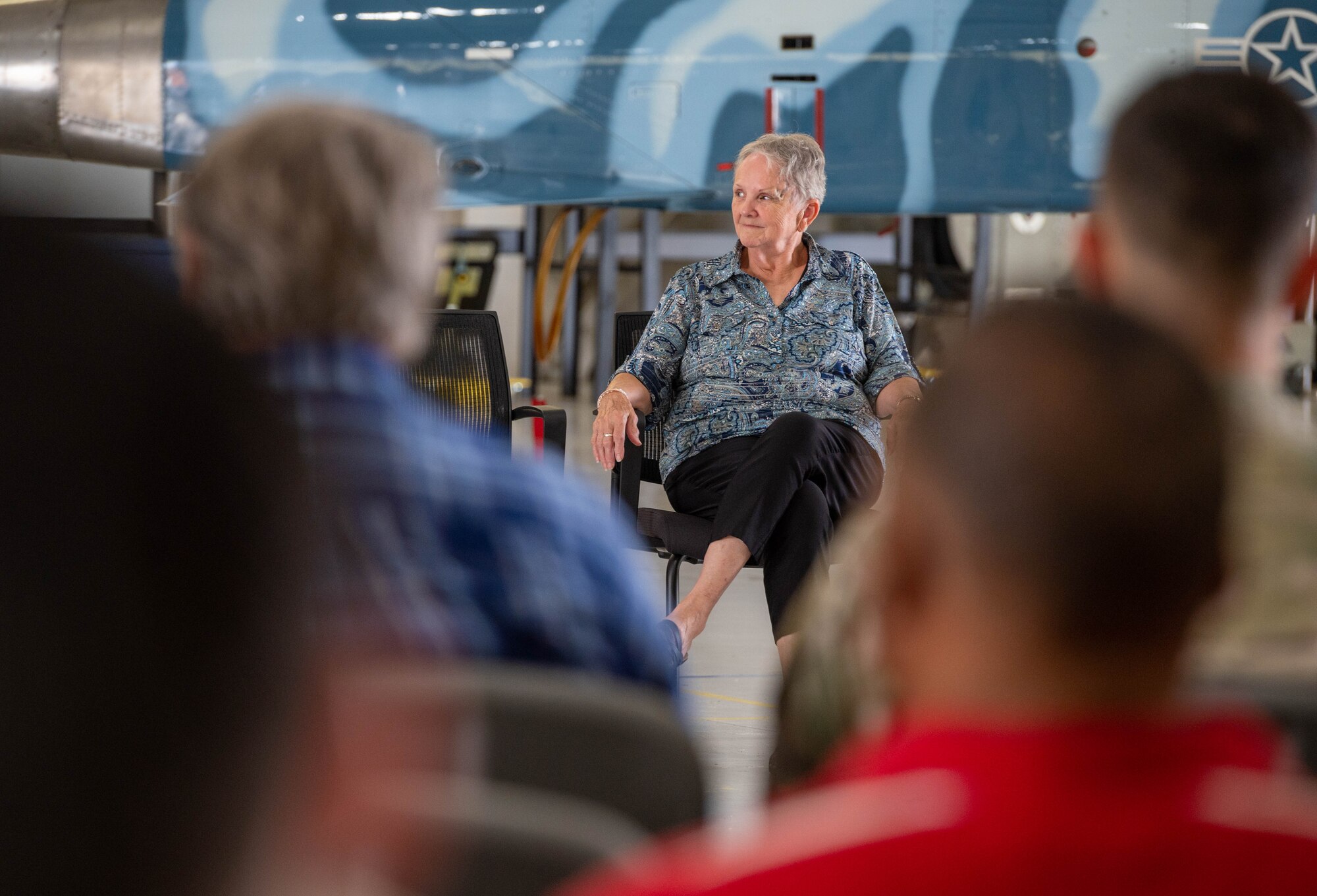 Vanessa Linden, 1st Maintenance Group commander’s executive assistant, listens to U.S. Air Force Col. Neal Van Houten, 1st Maintenance Group commander, speak during her retirement ceremony at Joint Base Langley-Eustis, Virginia, June 30, 2023.