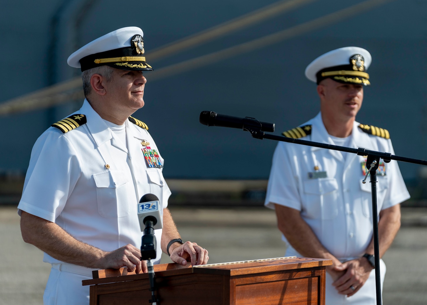 Capt. Martin Robertson, commander, Amphibious Squadron 8, addresses media as the amphibious assault ship USS Bataan (LHD 5) prepares to depart from Naval Station Norfolk for a scheduled deployment, July 10, 2023.