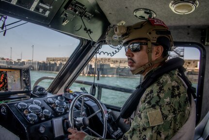 2300620-N-NT795-875 SEAL BEACH Calif., (June. 20, 2023) Engineman 1st Class Enrique Peraza, a tactical craft coxswain assigned to Maritime Expeditionary Security Squadron (MSRON) 11 operate a 34-foot patrol boat during out bound transit during Maritime Expeditionary Security Force (MESF) Boat University (BU) Tactical Craft Crewman/Gunner course, along Seal Beach harbor, Calif. MESF BU is designed to train and qualify the MESF to sustain mobilization readiness. MESF is a core Navy capability that provides port and harbor security, high value asset security, and maritime security in the coastal and inland waterways. (U.S. Navy photo by Chief Boatswain’s Mate Nelson Doromal Jr./Released)