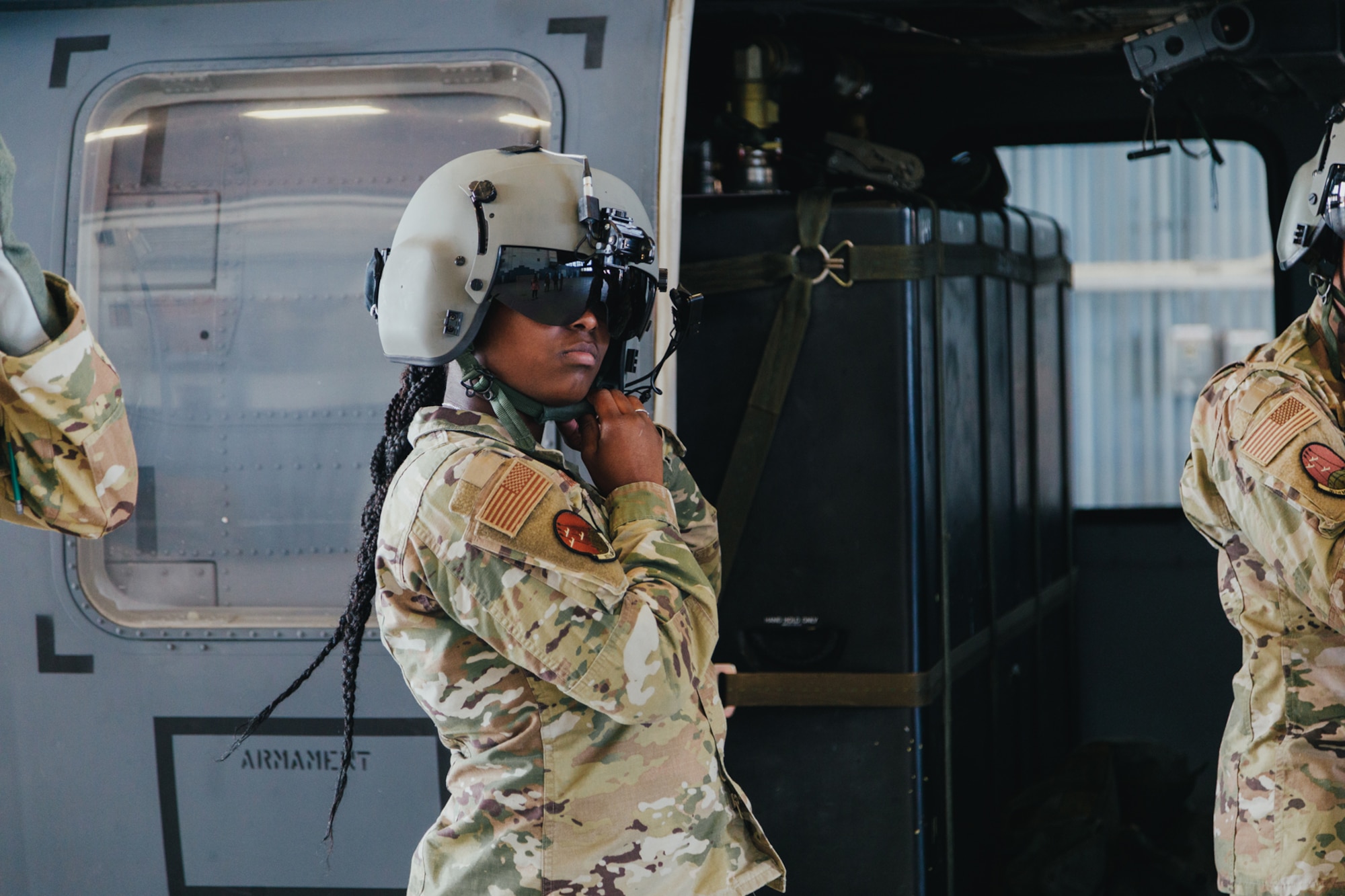 Airmen puts on helmet