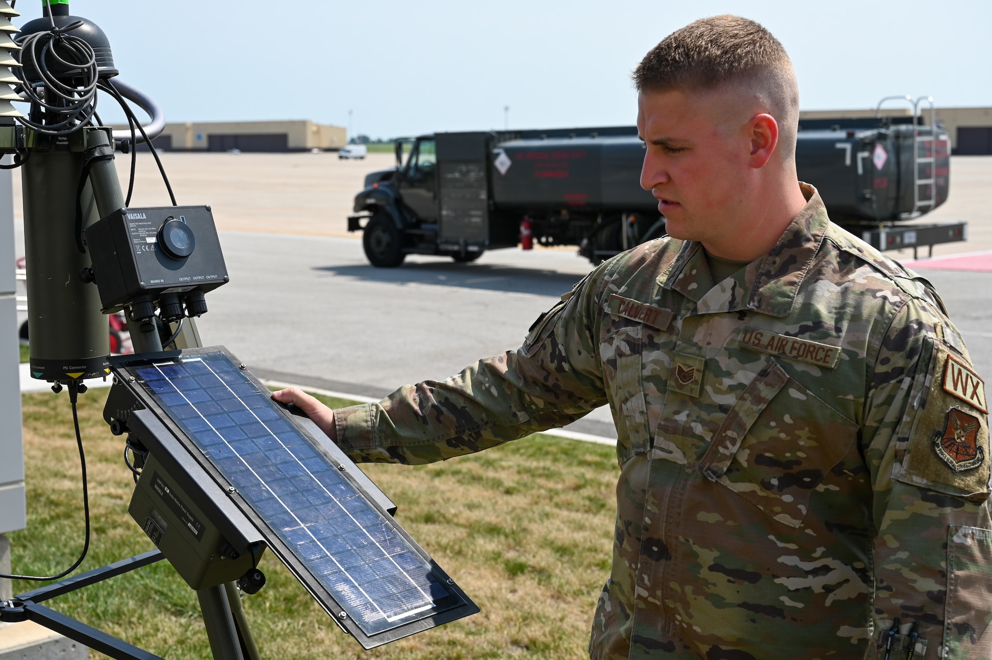 Staff Sgt. Luke Calvert, 509th OSS noncommissioned officer in charge of weather operations, sets up the TMQ-53 weather sensor at Whiteman Air Force Base, Mo., June 27, 2023. When active, the sensor sends collected weather data directly to the weather flight. (U.S. Air Force photo by A1C Robert Hicks)