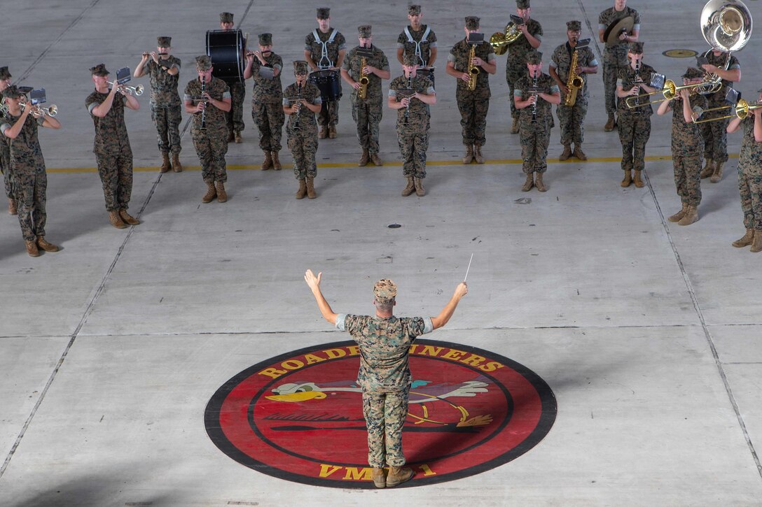 Marines with 2nd Marine Aircraft Wing band perform during 2nd MAW’s change of command, at Marine Corps Air Station Cherry Point, North Carolina, July 10, 2020. Maj. Gen. Karsten S. Heckl, outgoing commanding general, relinquished command to Maj. Gen. Michael S. Cederholm, oncoming commanding general, signifying the transfer of responsibility, authority and accountability. (U.S. Marine Corps photo by Lance Cpl. Steven Walls)
