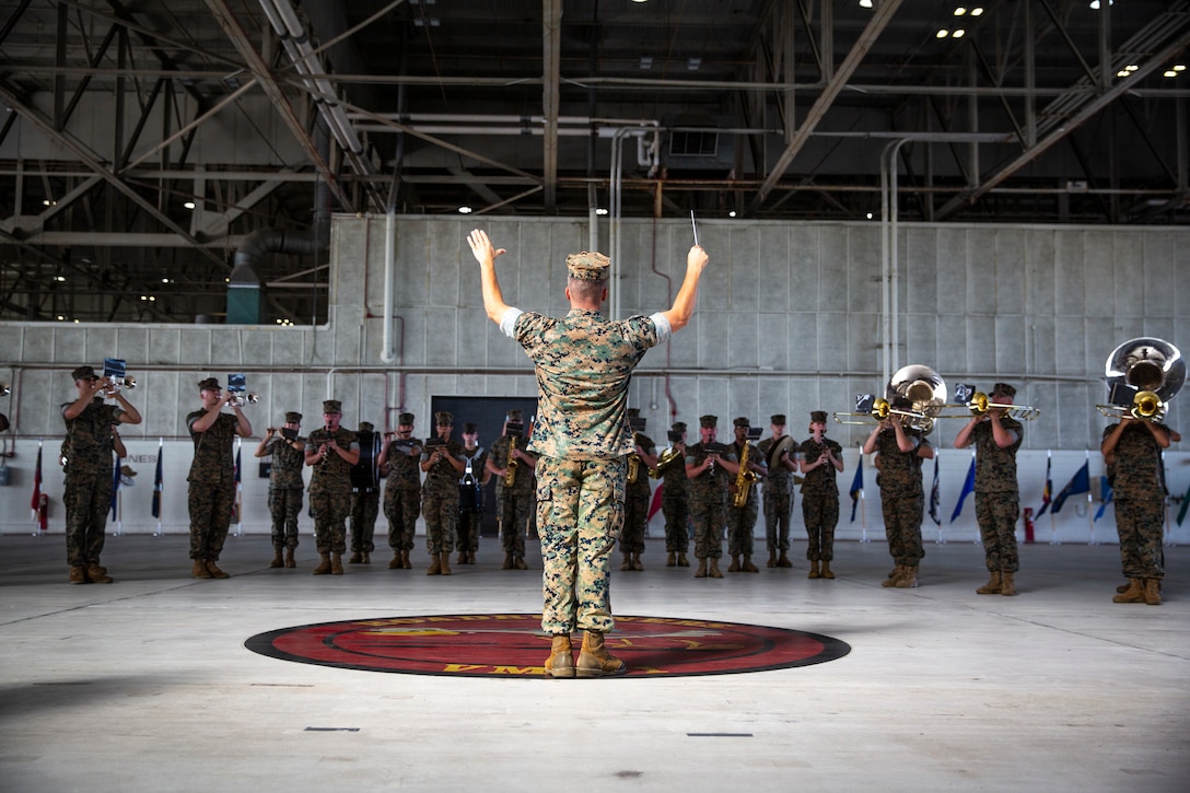 The 2nd Marine Aircraft Wing Band plays at 2nd MAW’s change of command ceremony at Marine Corps Air Station Cherry Point, North Carolina, July 10, 2020. Maj. Gen. Karsten Heckl, the former commanding general of 2nd MAW, relinquished command to Maj. Gen. Michael Cederholm, signifying the transfer of responsibility, authority and accountability from the outgoing commanding general to the oncoming. (U.S. Marine Corps photo by Cpl. Cody Rowe)