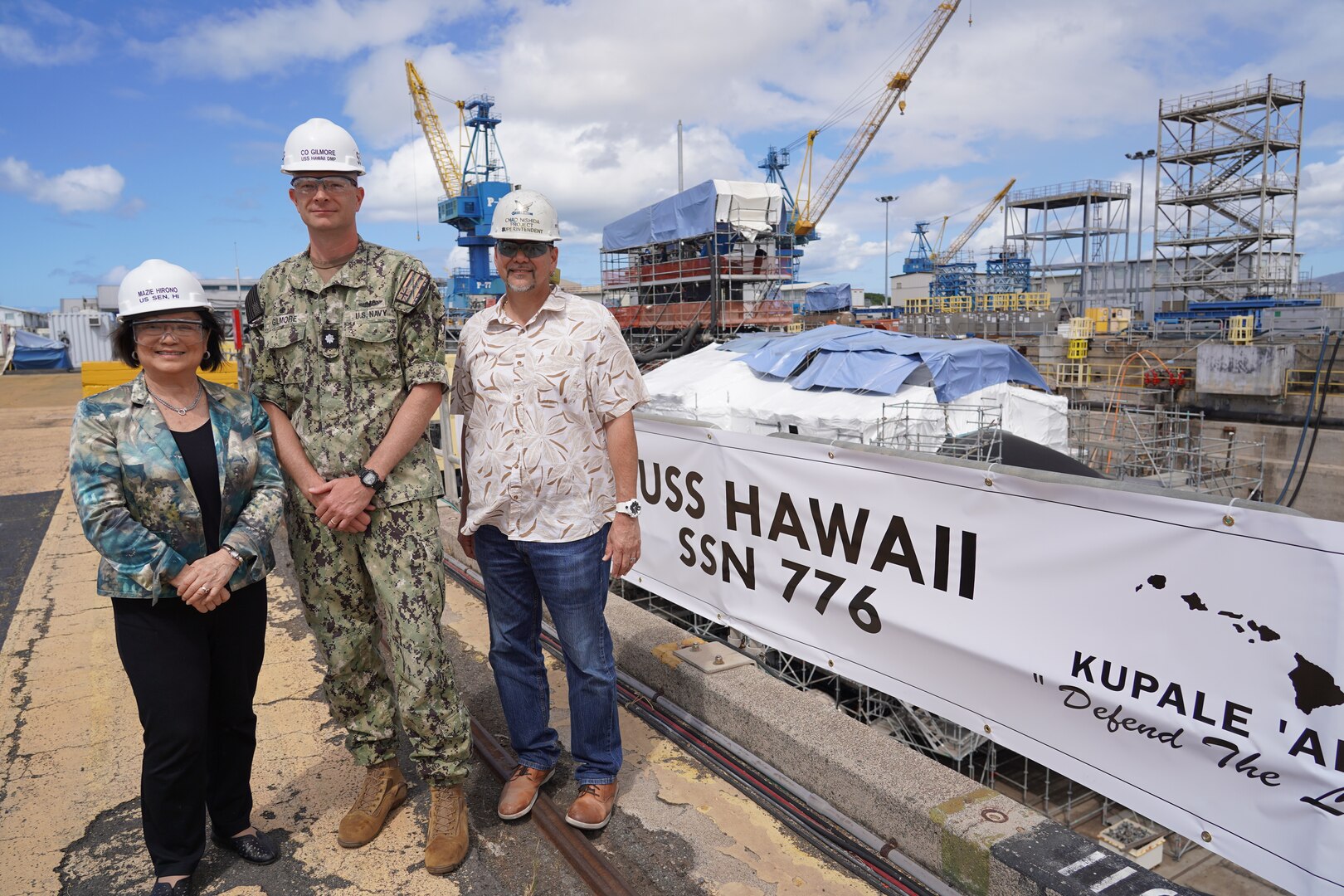 Sen. Mazie Hirono, left, poses with USS Hawaii Commanding Officer Preston Gilmore, center, and USS Hawaii Project Superintendent Chad Nishida, right, during a tour of Pearl Harbor Naval Shipyard