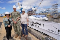 Sen. Mazie Hirono, left, poses with USS Hawaii Commanding Officer Preston Gilmore, center, and USS Hawaii Project Superintendent Chad Nishida, right, during a tour of Pearl Harbor Naval Shipyard