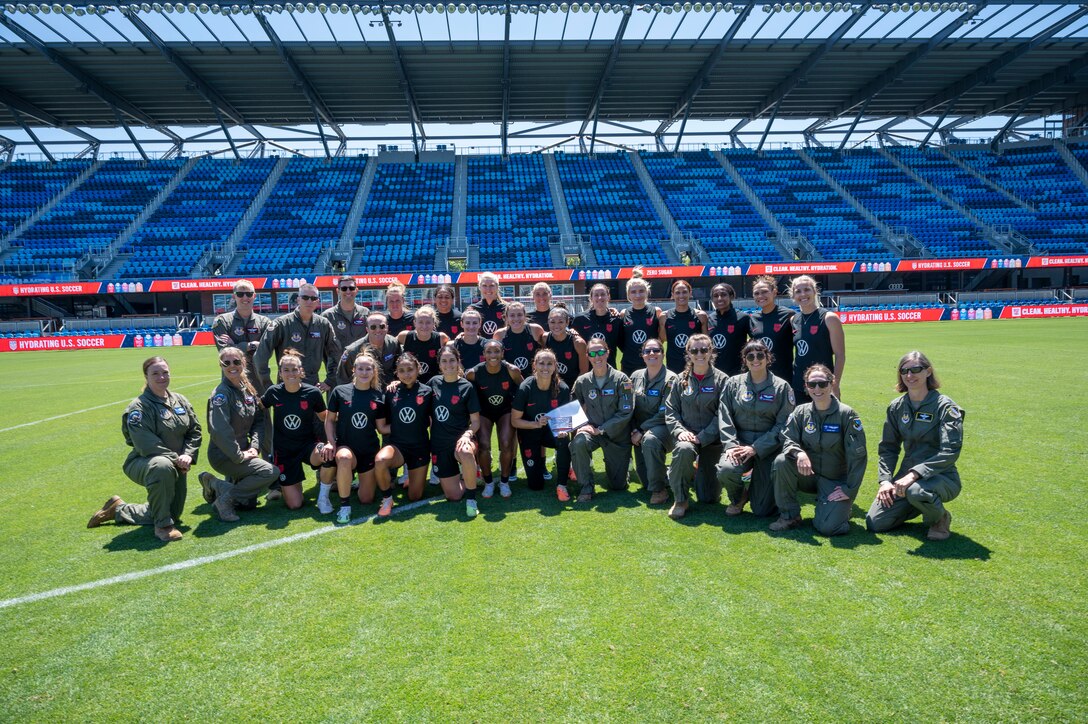 Members from the 412th Operations Group pose for a photo with the U.S. Women's National Team. Team Edwards sent an all female crew from the 412th Operations Group to conduct a special flyover for the National Women's Soccer League at PayPal Park July 9 in San Jose, California.