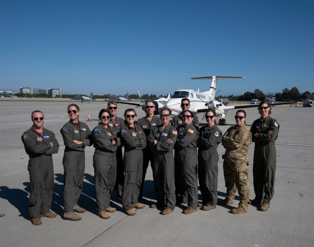 Members from the 412th Operations Group pose for a photo in front of a C-12 Huron July 8. Team Edwards sent an all female crew from the 412th Operations Group to conduct a special flyover for the National Women's Soccer League at PayPal Park July 9 in San Jose, California.