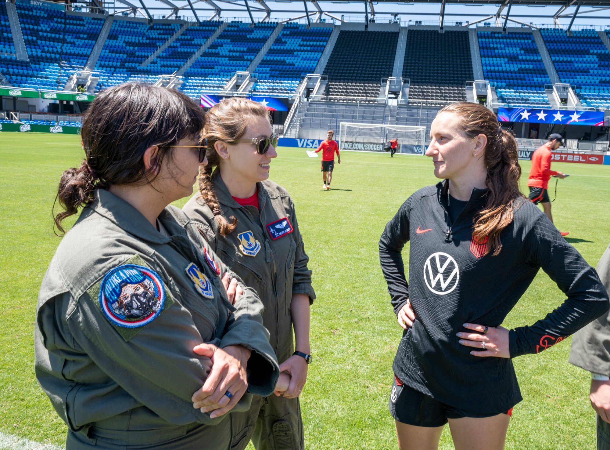 Kaitlyn Steigerwald, 412th Test Wing Public Affairs and Rebecca Aronoff, 420th Flight Test Squadron speak to a National Women's Soccer League player at PayPal Park, July 8. Team Edwards sent an all female crew from the 412th Operations Group to conduct a special flyover for the National Women's Soccer League at PayPal Park July 9 in San Jose, California.