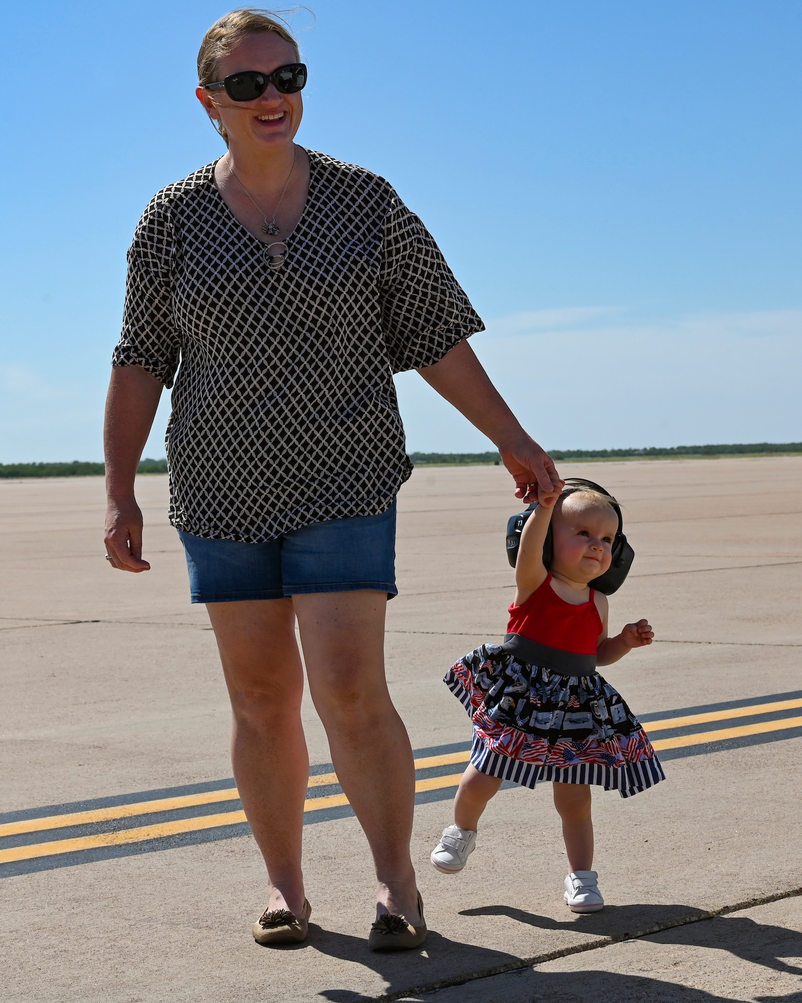Kathleen and Hannah Kippie, wife and daughter of Col. Kevin Kippie, 7th Bomb Wing vice commander, walk on the flightline at Dyess Air Force Base, Texas, June 29, 2023. Kippie served at Dyess from June 11, 2021, to June 16, 2023. While at Dyess, Kippie was committed to excellence as he fostered financial innovation and proposals for the installation, created a Wing Welcome Center for new Airmen and worked in integrated teams to action the wing’s fiscal efforts. (U.S. Air Force photo by Airman 1st Class Emma Anderson)