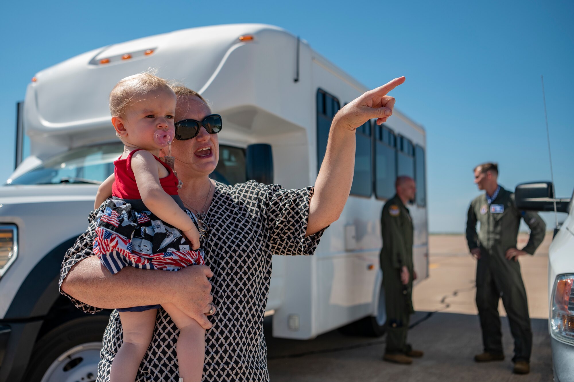 Kathleen and Hannah Kippie, wife and daughter of Col. Kevin Kippie, 7th Bomb Wing vice commander, watches a B-1B Lancer prepare to land at Dyess Air Force Base, Texas, June 29, 2023. Kippie served at Dyess from June 11, 2021, to June 16, 2023. While at Dyess, Kippie was committed to excellence as he fostered financial innovation and proposals for the installation, created a Wing Welcome Center for new Airmen and worked in integrated teams to action the wing’s fiscal efforts. (U.S. Air Force photo by Senior Airman Ryan Hayman)