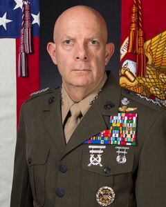 A man is photographed in his military dress uniform.