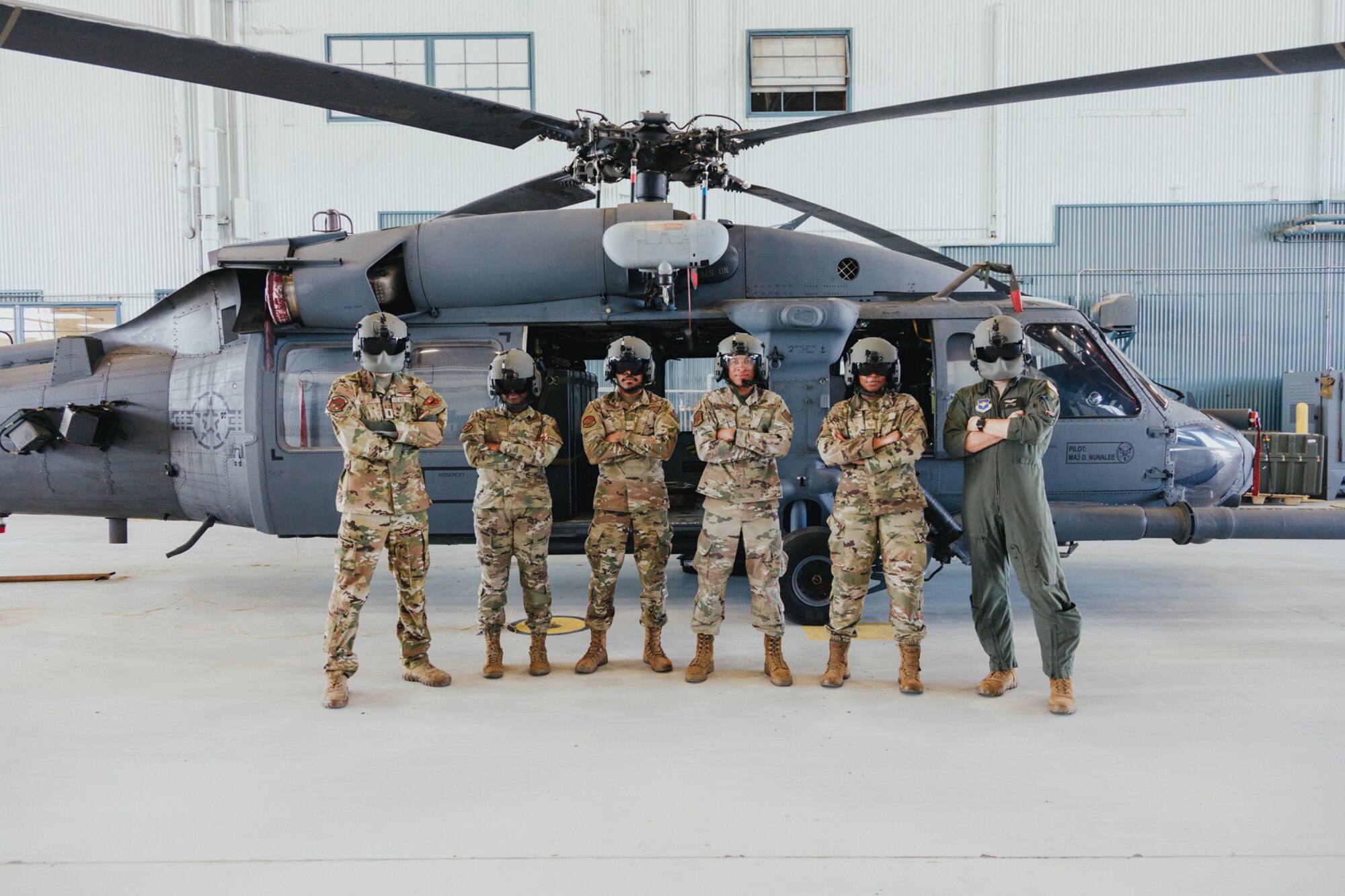 People stand in front of aircraft