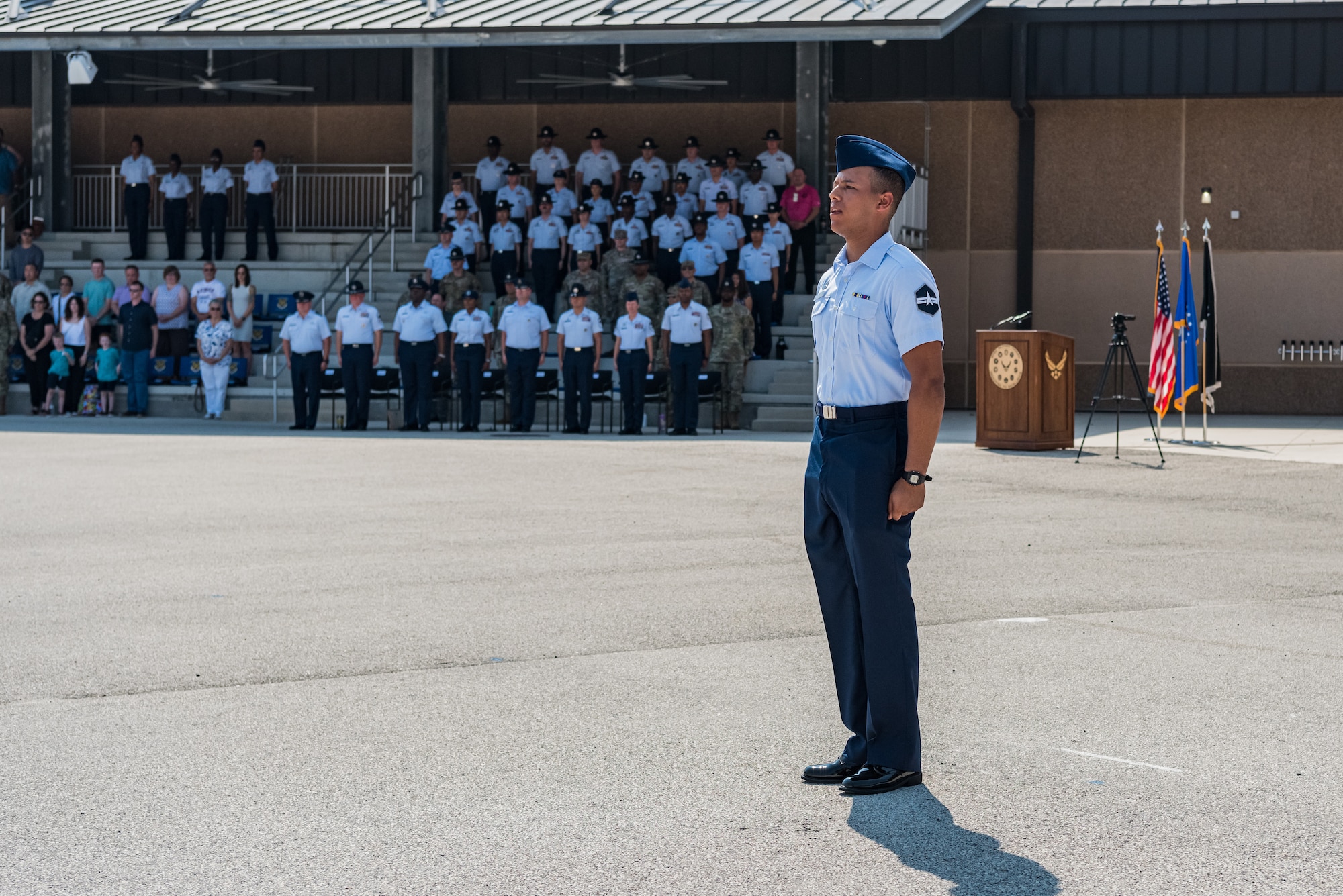 U.S. Space Force Specialist 3 Dakota Desrosiers, all-source intelligence analyst, center, leads Basic Military Training graduates in reciting the Airman’s Creed during a coining ceremony at Joint Base San Antonio–Lackland, Texas, on June 21, 2023.