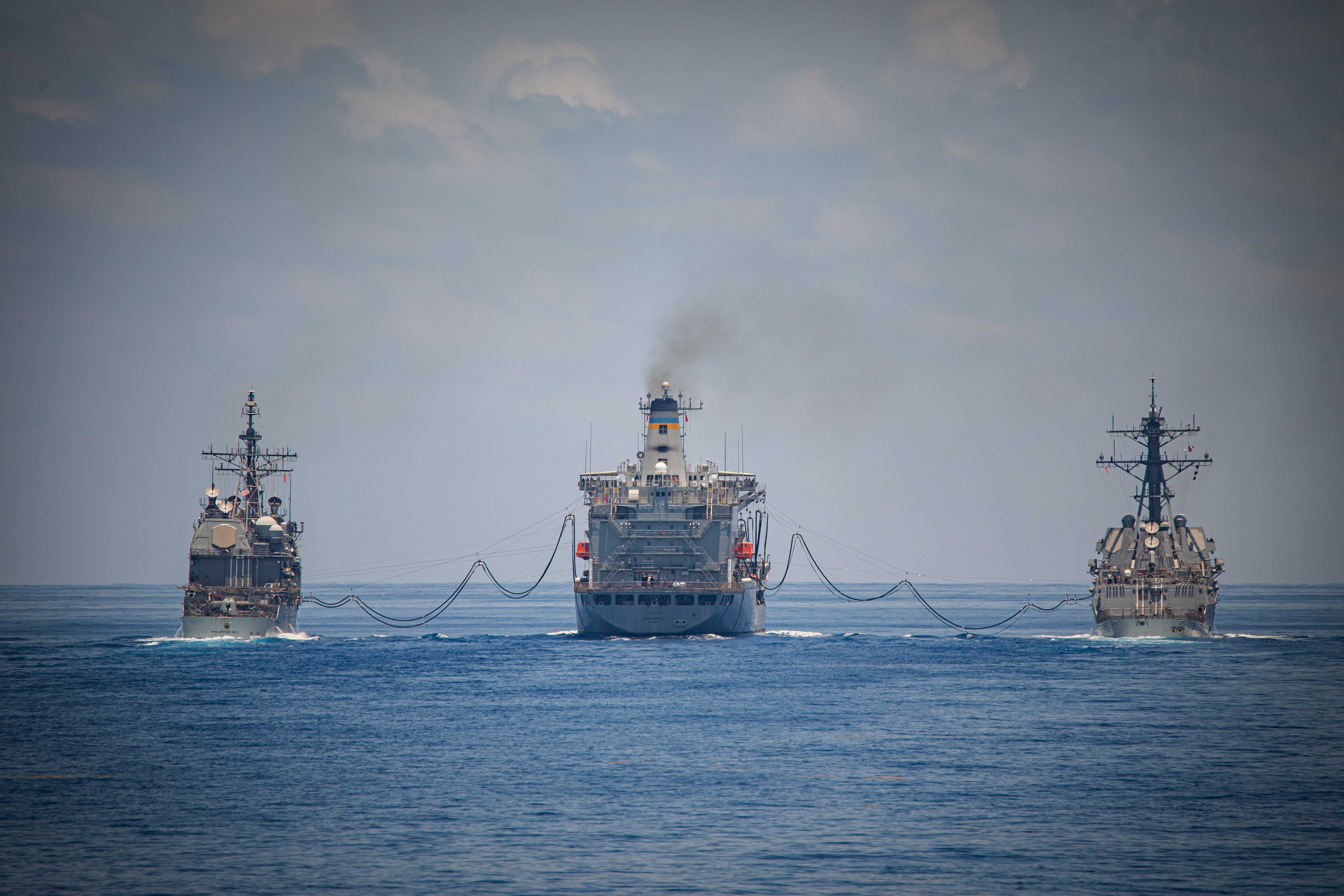 USS Philippine Sea (CG 58), left, and USS Gravely (DDG 107),replenish from USNS John Lenthall (T-AO 189) the Atlantic Ocean.