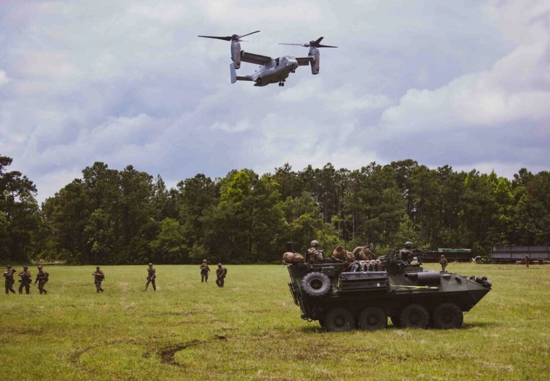 U.S. Marine Corps Light Armored Vehicles with the 26th Marine Expeditionary Unit conduct an amphibious assault during Composite Training Unit Exercise (C2X) on Marine Corps Base Camp Lejeune, North Carolina, June 2, 2023. The amphibious assault rehearsed the utilization of Marines to move from ship to shore and secure objectives for follow-on actions. C2X is the last exercise in the pre-deployment training program for the Bataan Amphibious Ready Group. (U.S. Marine Corps photo by Cpl. Aziza Kamuhanda)