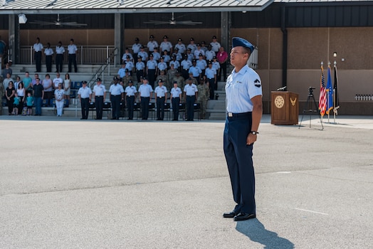  U.S. Space Force Specialist 3 Dakota Desrosiers, all-source intelligence analyst, center, leads Basic Military Training graduates in reciting the Airman’s Creed during a coining ceremony at Joint Base San Antonio–Lackland, Texas, on June 21, 2023.