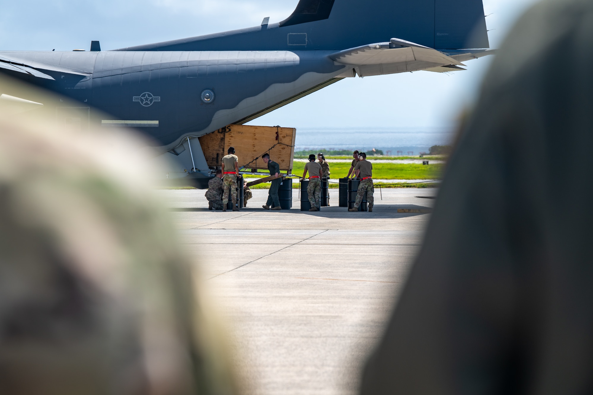 Maintainers unload an aircraft.