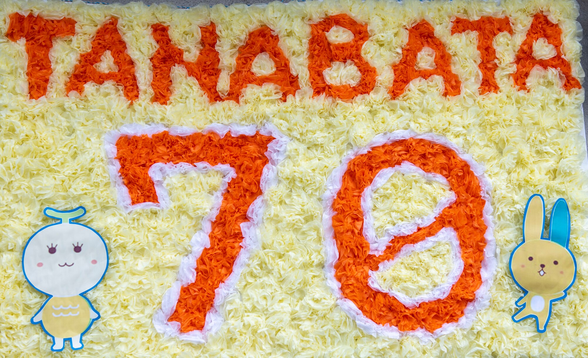 A papercraft sign displaying "Tanabata 70"