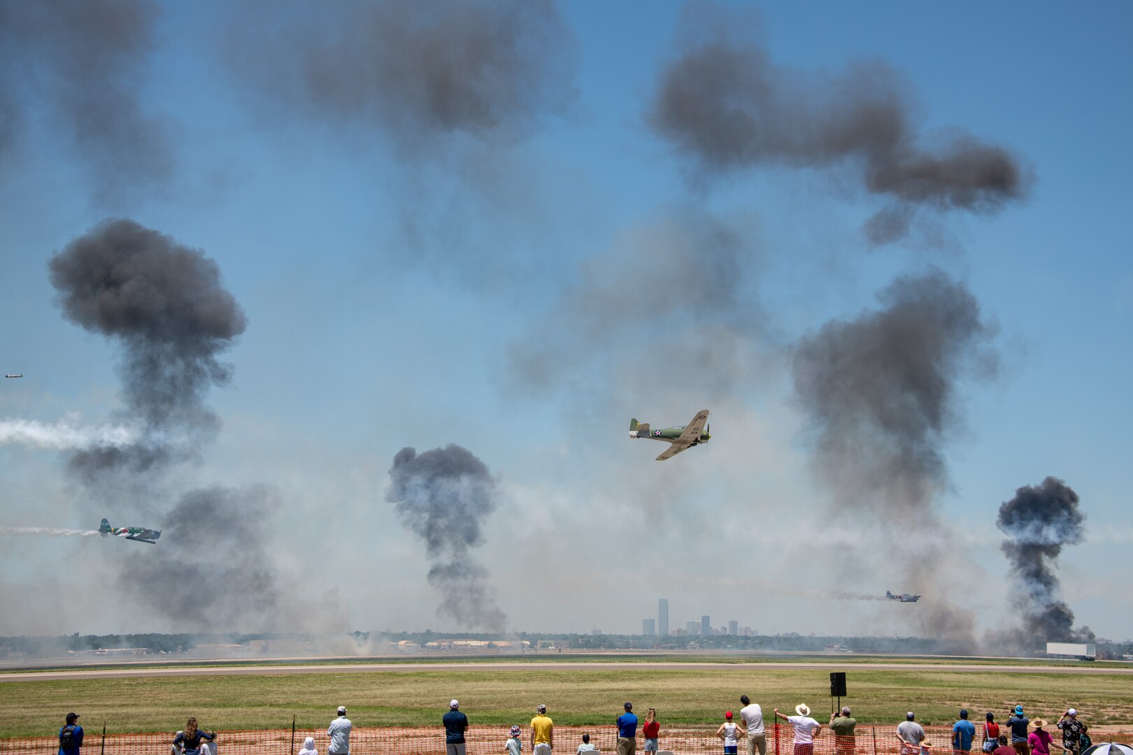 Aircraft perform a living history lesson about the attack on Pearl Harbor at Tinker Air Force Base, Oklahoma City, July 2, 2023. Airmen with the 137th Special Operations Wing joined members of the joint and total force at the Tinker Air Show to showcase the diverse aspects of aviation. (U.S. Air National Guard photo by Tech. Sgt. Brigette Waltermire)