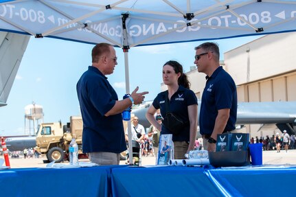 From left: 137th Special Operations Wing Command Chief Master Sgt. Lawrence DeSalle, Master Sgt. Kasey Phipps, a 137th SOW recruiter, and Senior Master Sgt. Andrew LaMoreaux, marketing and recruiting superintendent for the Oklahoma Air National Guard, converse at the Tinker Air Show on July 1, 2023, at Tinker Air Force Base, Oklahoma City. The 137th Special Operations Wing joined members of the total force at the Tinker Air Show, which showcased the diverse aspects of aviation. (U.S. Air National Guard photo by Airman 1st Class Erika Chapa)