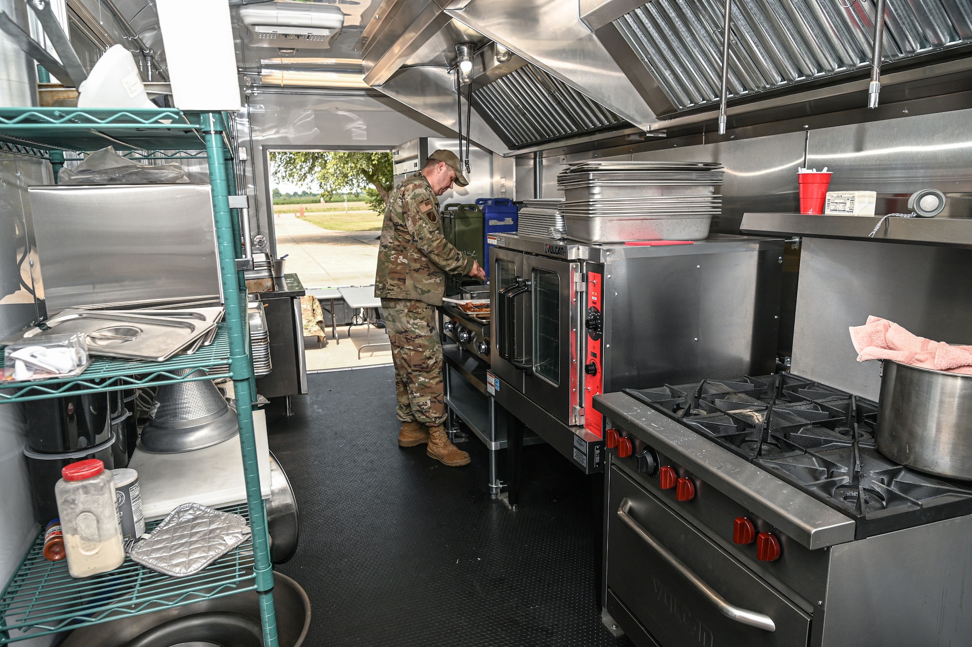 U.S. Air Force Staff. Sgt. Lonnie Obermark, a food service craftsman assigned to the 131st Bomb Wing, Missouri Air National Guard, fries beef for a meal during Operation Healthy Delta Innovative Readiness Training Program at Sikeston, Missouri, June 13, 2023. Services Airmen gained real-world adaptability experience while serving more than 800 meals per day to service members involved in the DOD sponsored program that was designed to build relationships with local communities by providing key medical, dental, and optometry services at no cost. (U.S. Air National Guard photo by Airman 1st Class Danielle Dawson)