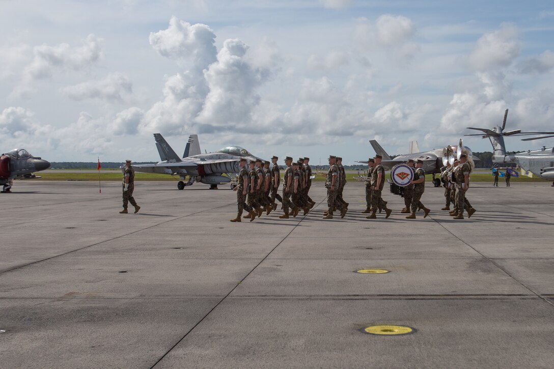 U.S. Marines with 2nd Marine Aircraft Wing (MAW) march in formation during a change of command ceremony at Marine Corps Air Station Cherry Point, North Carolina, June 30, 2022. The ceremony represented a transfer of responsibility, authority, and accountability from Maj. Gen. Michael S. Cederholm to Maj. Gen. Scott F. Benedict. 2nd MAW is the aviation combat element of II Marine Expeditionary Force. (U.S. Marine Corps photo by Lance Cpl. Anakin Smith)