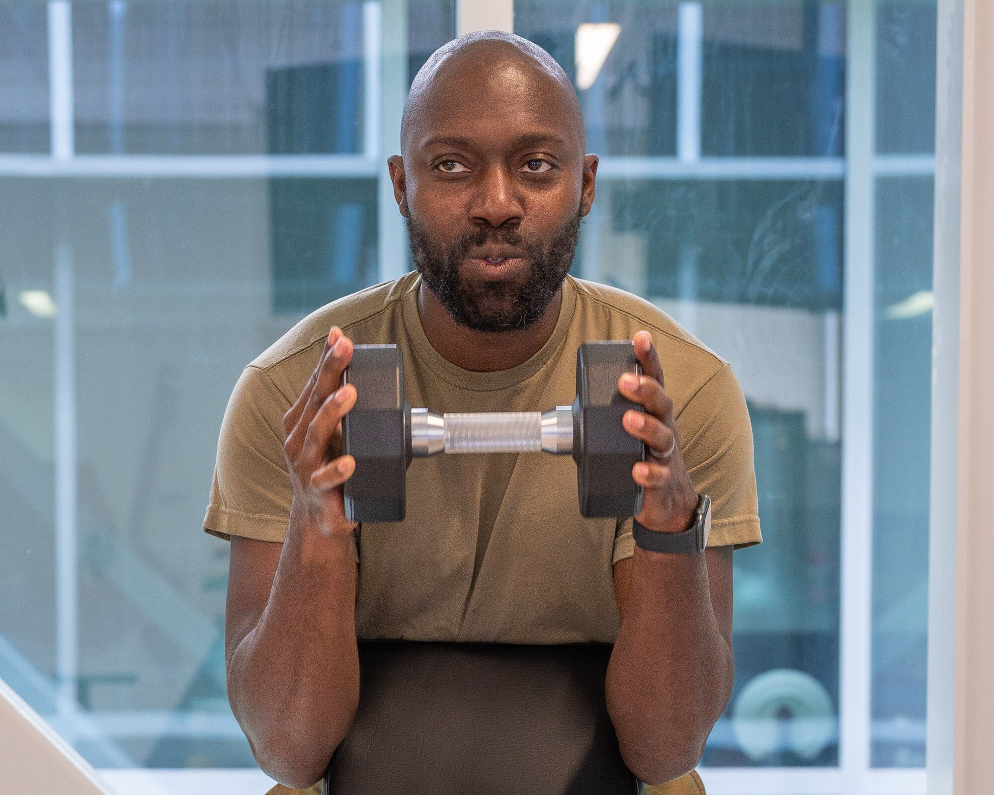 Tech. Sgt. Jarvis James, 567th Red Horse Squadron unit training manager, exercises using a dumbbell at Seymour Johnson Air Force Base, North Carolina, June 22, 2023. The physical therapy clinic’s vision is to maintain professional airmen ready to fight, and one of the wing commander’s priorities is to improve combat readiness. (U.S. Air Force photo by Airman 1st Class Leighton Lucero)