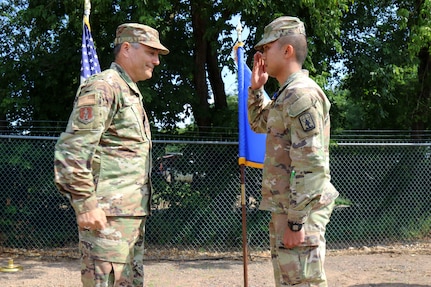 First Lt. Apiwit B. Chulawan, an officer with the Wisconsin Army Naitonal Guard’s 829th Engineer Vertical Construction Company, salutes Maj. Gen. Paul Knapp, Wisconsin’s adjutant general, after being awarded the Soldier’s Medal during a July 9, 2023, ceremony in Spooner, Wis. Chulawan was a passenger on a train that derailed in 2021 and helped aid injured passengers.