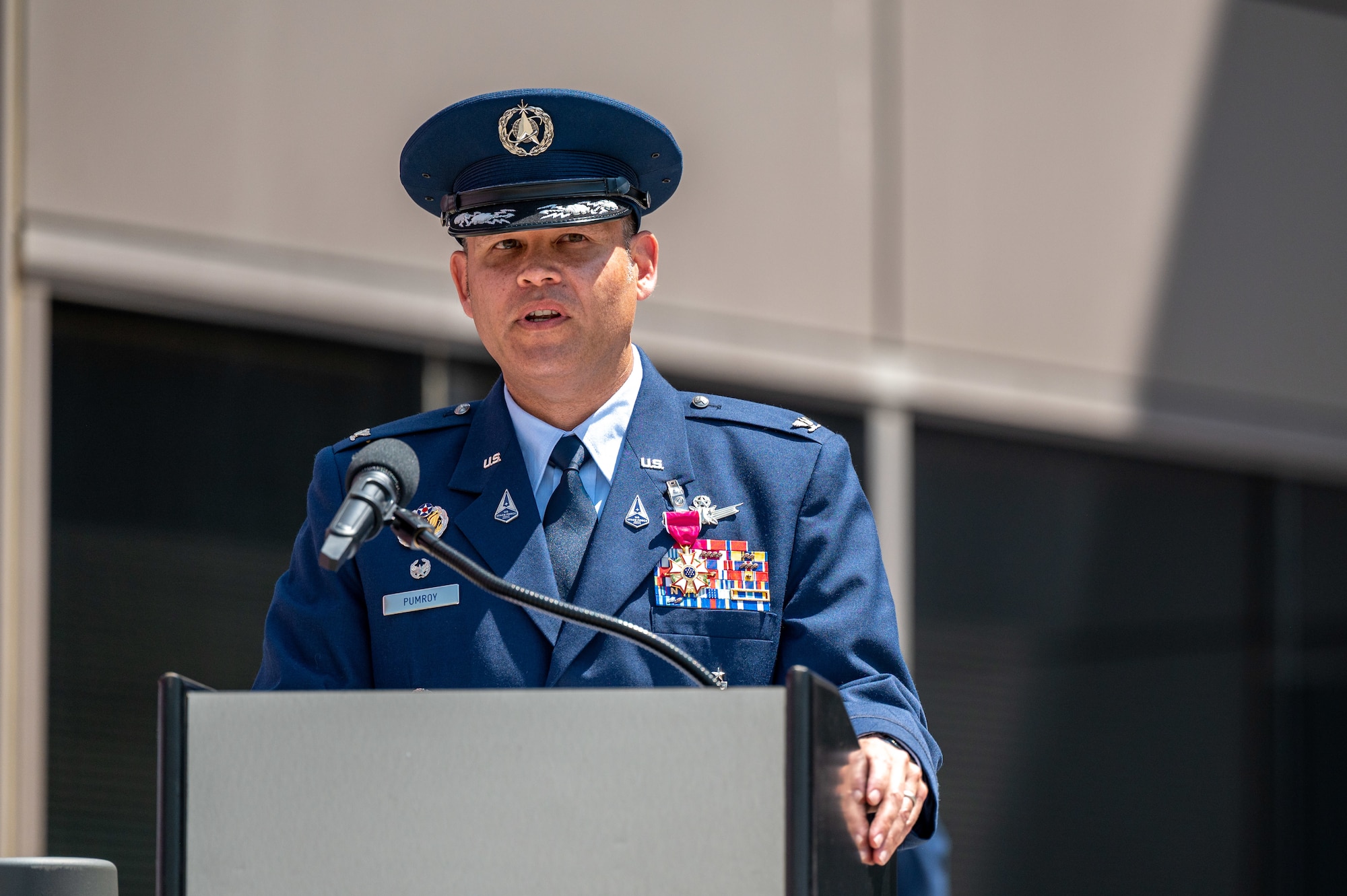 U.S. Space Force Col. Kyle Pumroy, the Delta 11 outgoing commander, delivers remarks during Delta 11’s change of command ceremony at Schriever Space Force Base, Colorado, July 7, 2023. Delta 11 is responsible for delivering realistic, threat-informed test and training resources to U.S. Space Force, joint, and coalition space operators via live, virtual, and constructive threat replication, leveraging the National Space Test and Training Complex across multiple space warfighting disciplines. (U.S. Space Force photo by Ethan Johnson)
