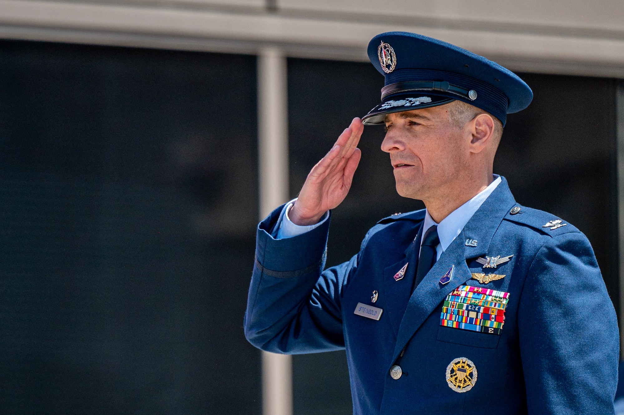 U.S. Space Force Col. Jay Steingold, the Delta 11 incoming commander, renders his first salute to members of the Delta during a change of command ceremony at Schriever Space Force Base, Colorado, July 7, 2023. Delta 11 is responsible for delivering realistic, threat-informed test and training resources to U.S. Space Force, joint, and coalition space operators via live, virtual, and constructive threat replication, leveraging the National Space Test and Training Complex across multiple space warfighting disciplines. (U.S. Space Force photo by Ethan Johnson)