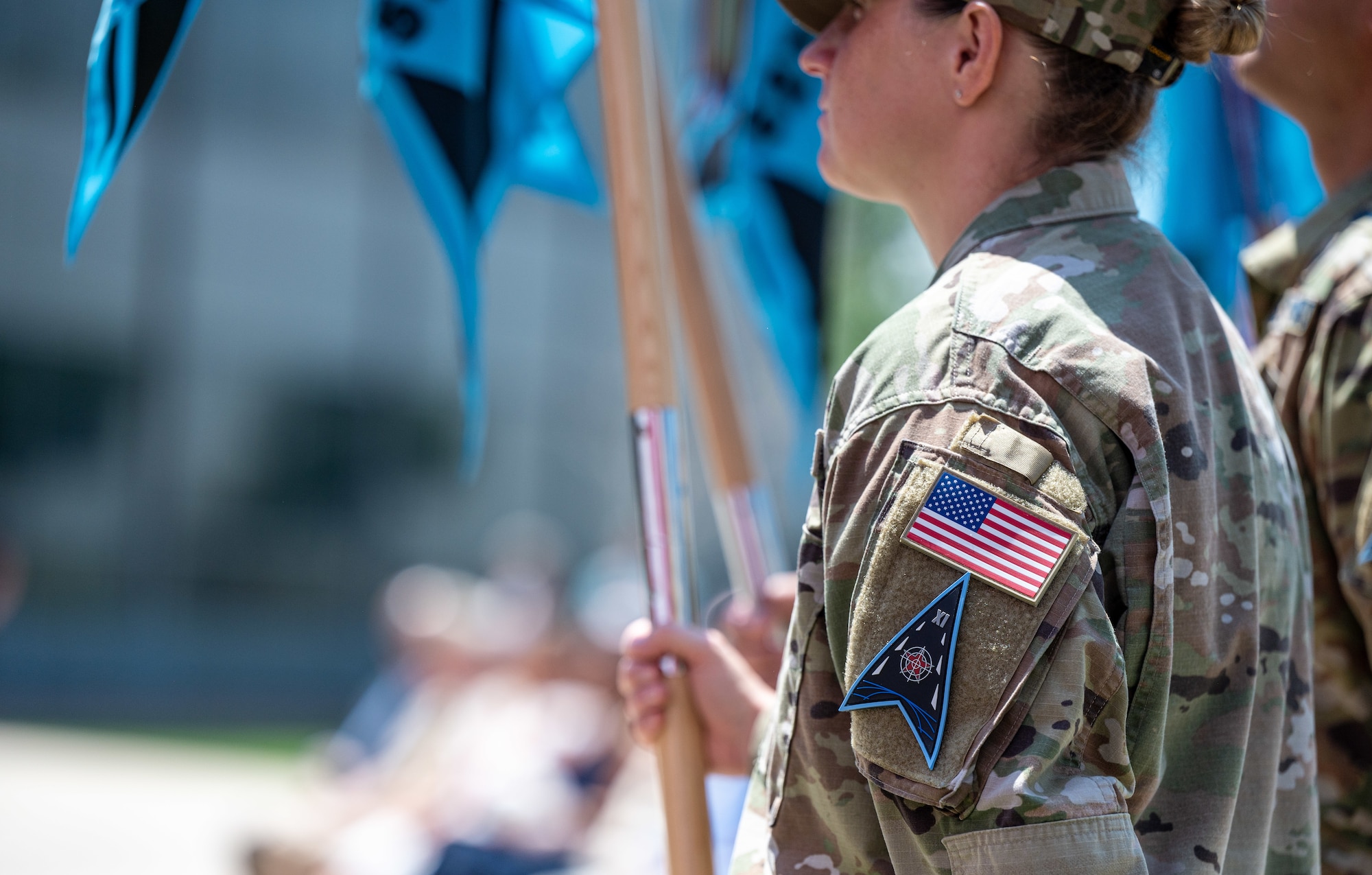 A member of Delta 11 holds the Delta guidon during Delta 11’s change of command ceremony at Schriever Space Force Base, Colorado, July 7, 2023. Delta 11 is responsible for delivering realistic, threat-informed test and training resources to U.S. Space Force, joint, and coalition space operators via live, virtual, and constructive threat replication, leveraging the National Space Test and Training Complex across multiple space warfighting disciplines. (U.S. Space Force photo by Ethan Johnson)