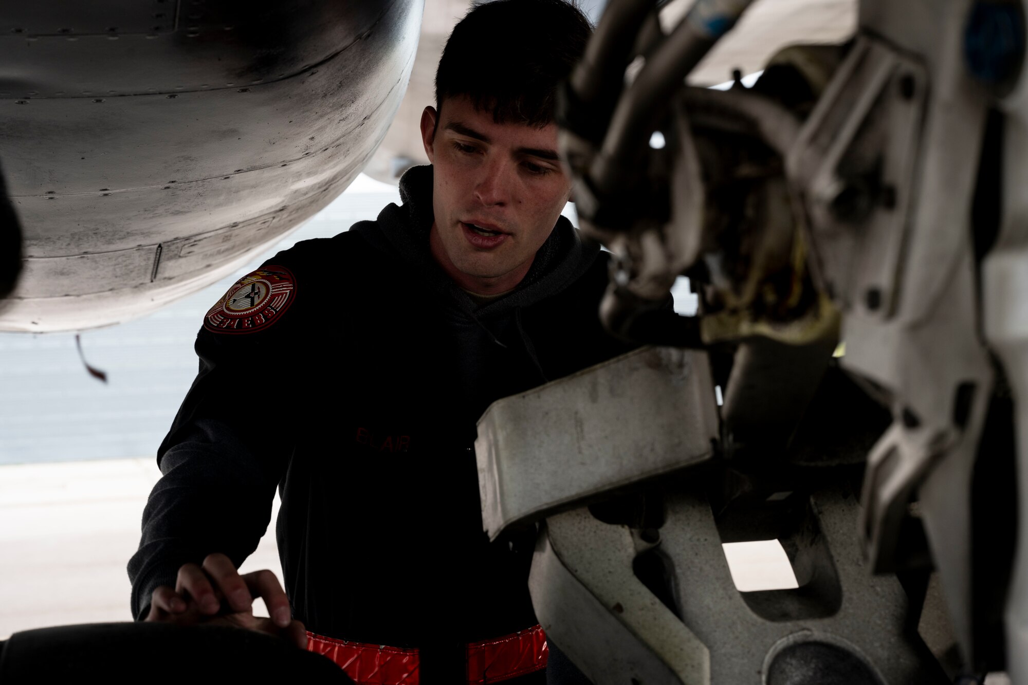 U.S. Air Force Staff Sgt. Noah Blair, 28th Aircraft Maintenance Squadron dedicated crew chief, performs preflight inspections and safe for maintenance checks during the first annual Mission Generation Competition at Ellsworth Air Force Base, South Dakota, July 7, 2023.