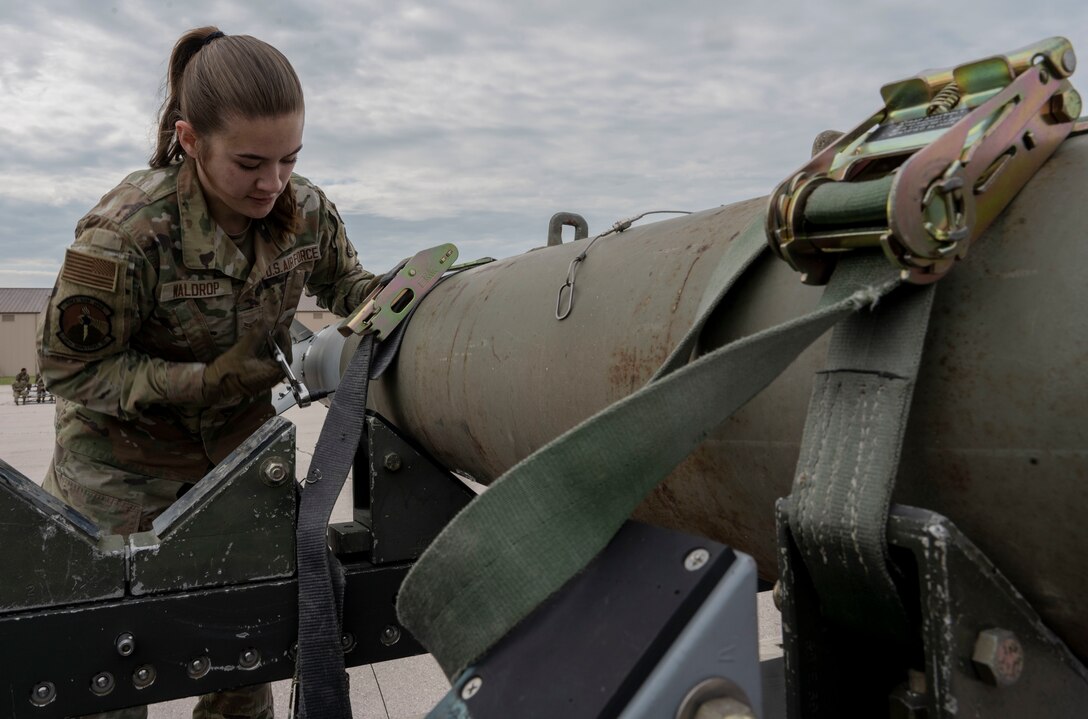 U.S. Air Force Airman 1st Class Mackenzie Waldrop, 28th Munitions Squadron line delivery technician, participates in a bomb build exercise during the first annual Mission Generation Competition at Ellsworth Air Force Base, South Dakota, July 7, 2023.