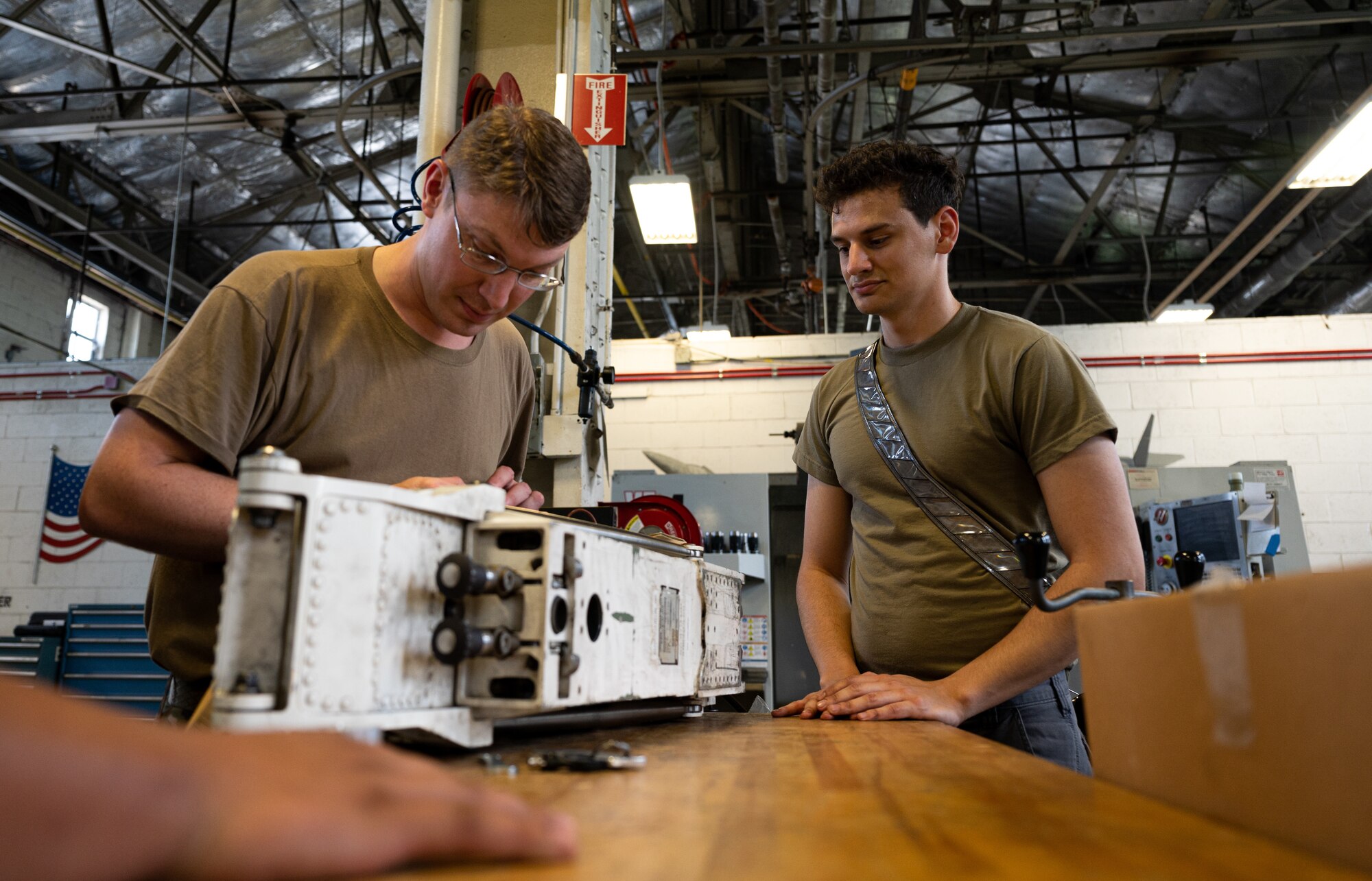 Metal Techs use a mill to repair F-22 machinery at JBLE