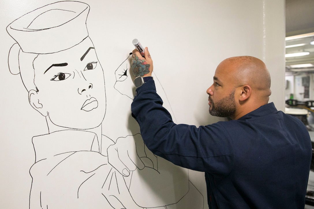 A sailor draws a service member rolling up their sleeves displaying their biceps.