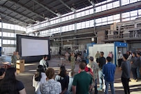 Officer in Charge of Construction, Pearl Harbor Naval Shipyard Capt. Stephen Padhi, center, briefs shipyard personnel during a Town Hall held at the Structural Shop at Pearl Harbor Naval Shipyard.