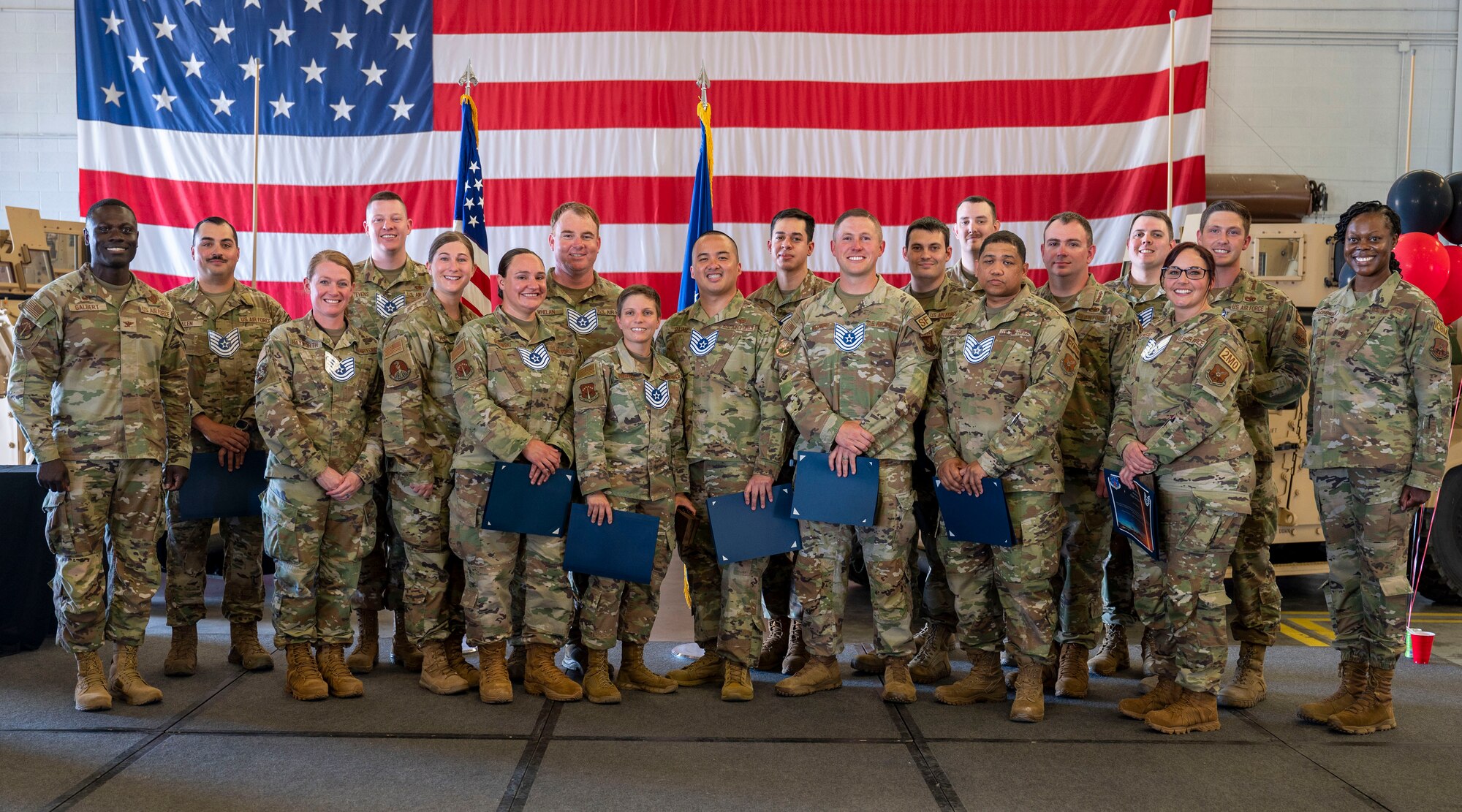 group photo with new tech sergeant selects in OCP uniforms
