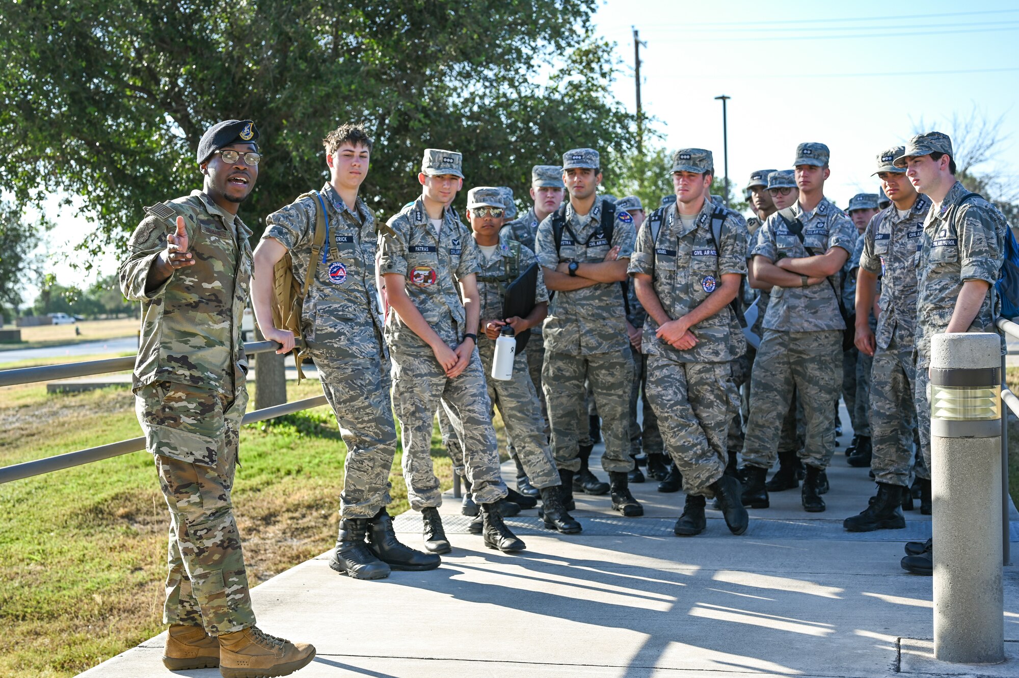 U.S. Air Force Senior Airman Tristen Richards (left), 47th Security Forces patrolman, leads Civil Air Patrol cadets into the main security forces building at Laughlin Air Force Base, Texas, June 28, 2023.