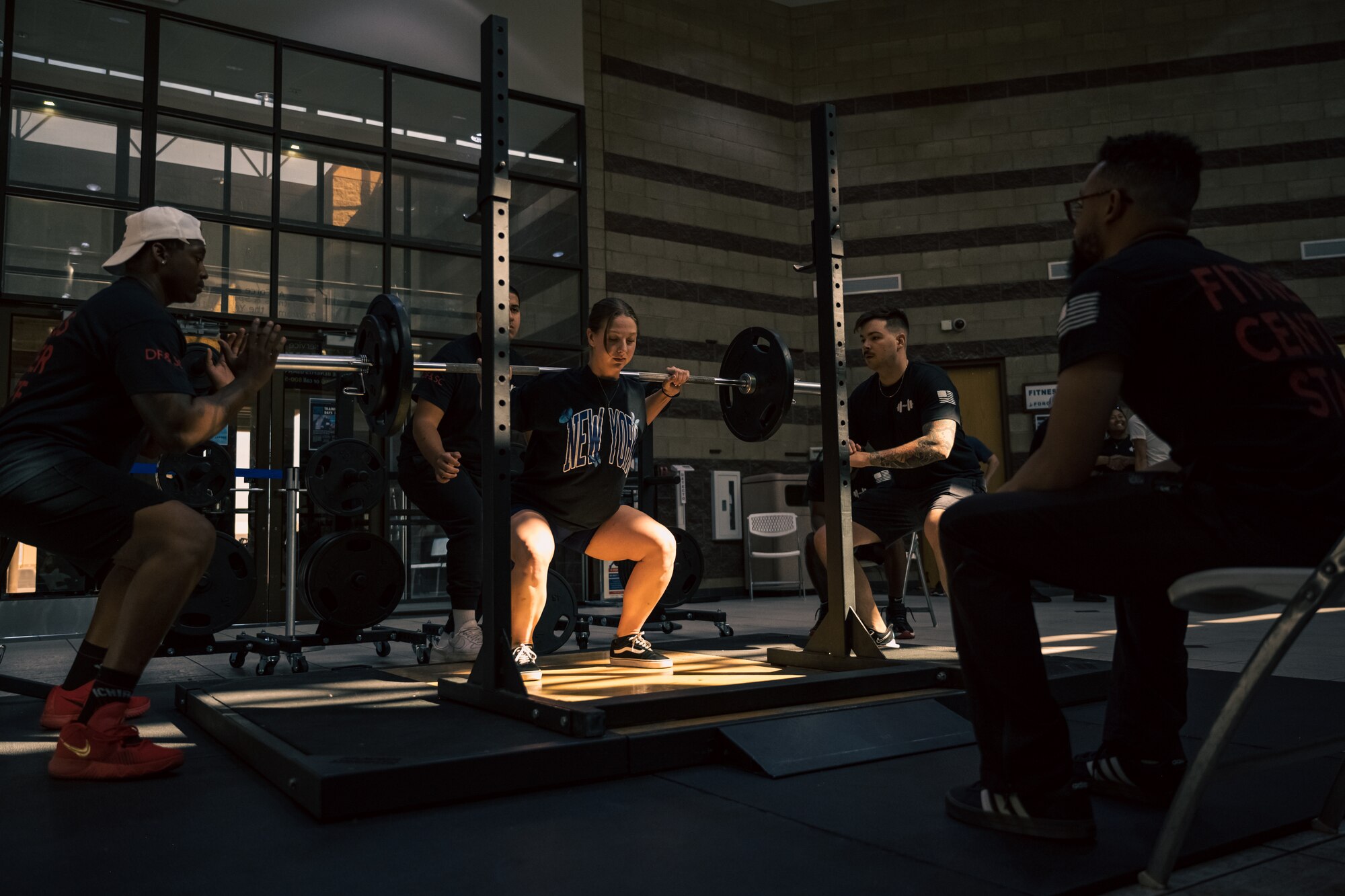 U.S. Air Force Senior Airman Anna Buiter, 49th Equipment Maintenance Squadron aircraft metals technologist, performs a back squat during a weightlifting meet at Holloman Air Force Base, New Mexico, July 8, 2023. The event consisted of various weightlifting exercises to improve morale and comradery while raising esprit de corps through healthy competition between Airmen and civilians. (U.S. Air Force photo by Senior Airman Antonio Salfran)