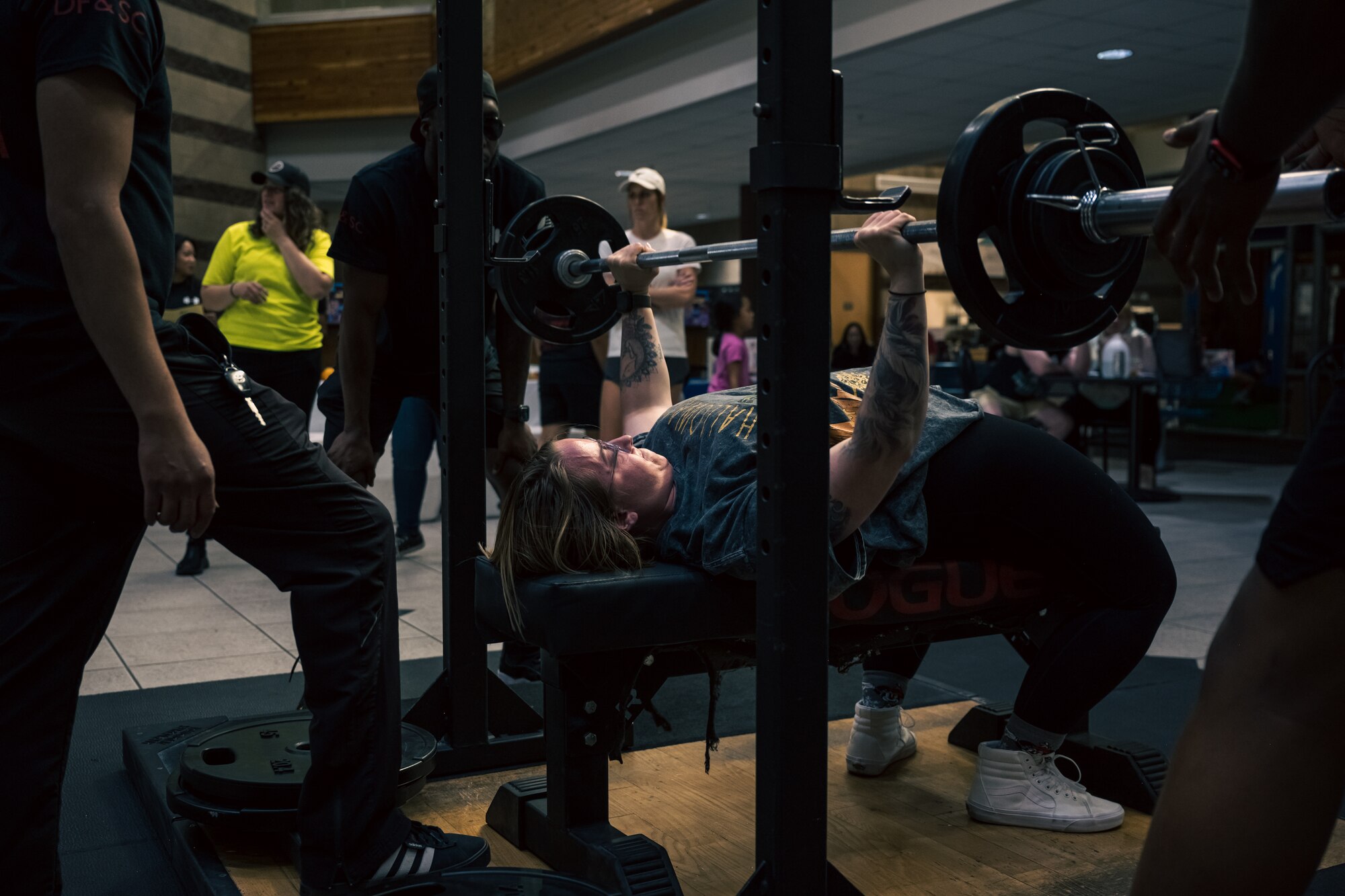 U.S. Air Force Staff Sgt. Kristina Bowers, 372nd Training Squadron F-16 crew chief instructor, performs a bench press during a weightlifting meet at Holloman Air Force Base, New Mexico, July 8, 2023. The 49th FSS hosts monthly events that encourage Airmen to excel in personal physical fitness, one of the pillars of the comprehensive Airmen fitness. (U.S. Air Force by Senior Airman Antonio Salfran)