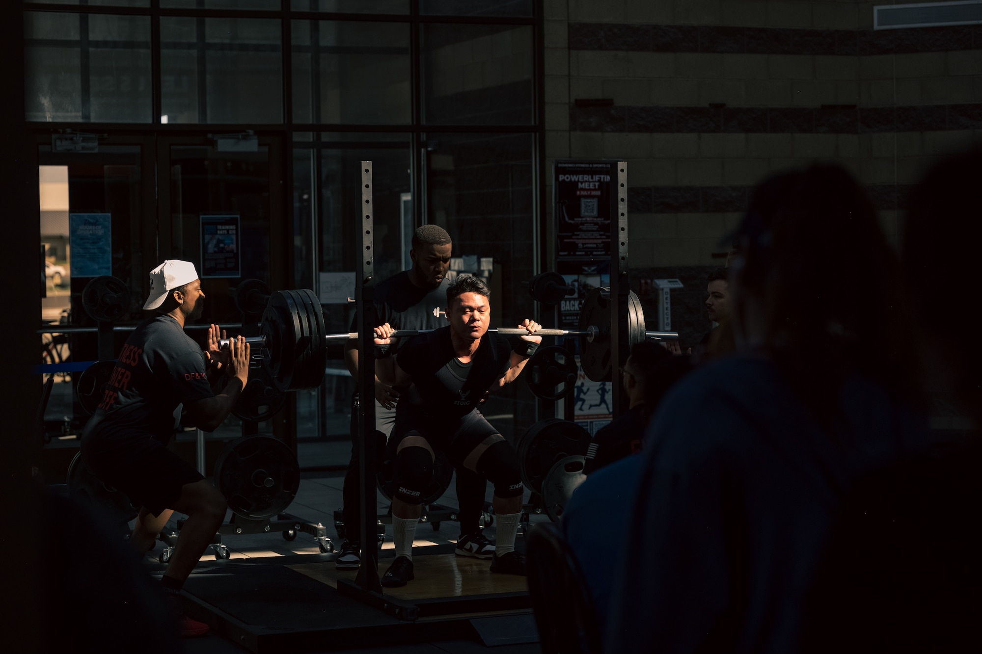 U.S. Air Force Airman 1st Class Francis Matthew Macaspac, 29th Aircraft Maintenance Unit weapons load crew member, performs a back squat during a weightlifting meet at Holloman Air Force Base, New Mexico, July 8, 2023. The event consisted of various weightlifting exercises to improve morale and comradery while raising esprit de corps through healthy competition between Airmen and civilians. (U.S. Air Force photo by Senior Airman Antonio Salfran)
