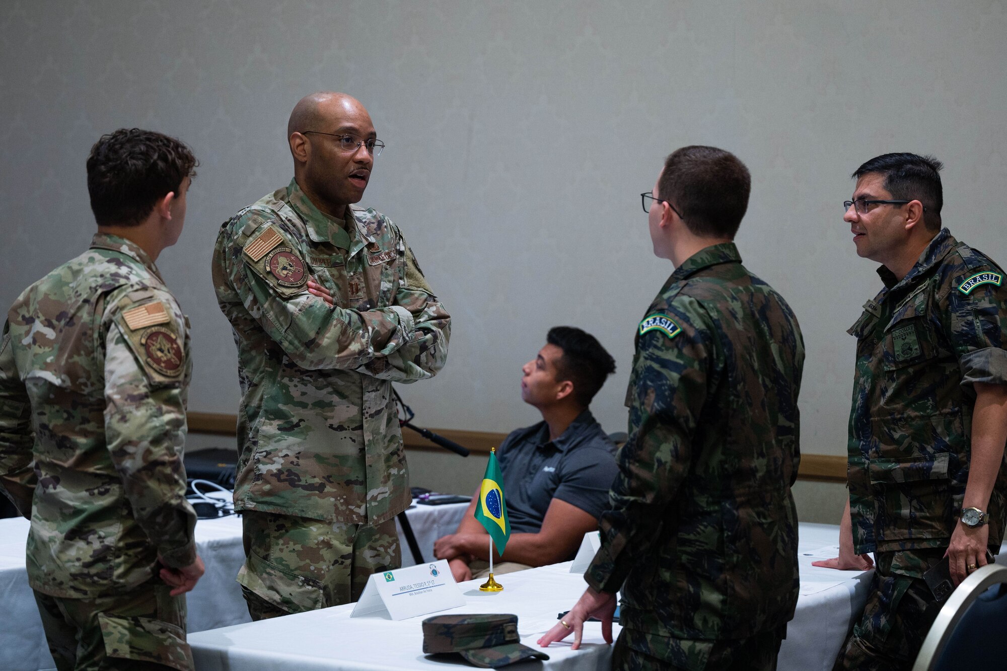 U. S. Air Force and Brazilian Air Force members discuss with one another while participating in the Global Sentinel 2024 Mid-Planning Conference at Vandenberg Space Force Base, Calif., June 29, 2023. Global Sentinel is USSPACECOM’s single largest multinational event and leading security cooperation effort designed to strengthen partnerships with other space-faring nations, improve operational collaboration, and promote responsible behavior in the space domain. (U.S. Space Force photo by Tech. Sgt. Luke Kitterman)