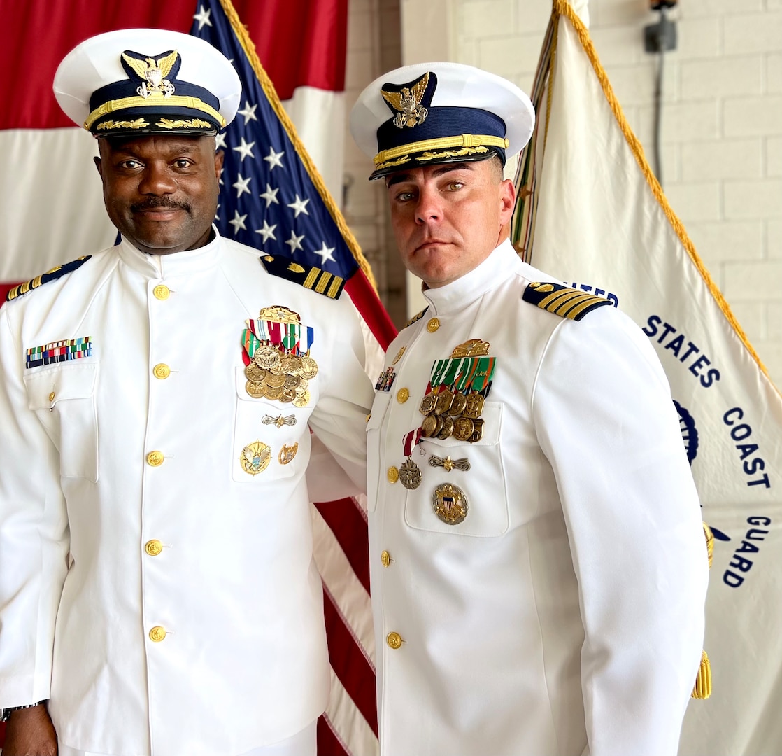 U.S. Coast Guard Cmdr. Raymond D. Jackson, left, relieves Capt. Frank J. Florio, right, as commanding officer of the Coast Guard Tactical Law Enforcement Team South during a change of command ceremony, July 11, 2023, at Coast Guard Air Station Miami. The change of command ceremony marks a transfer of total responsibility and authority from one individual to another. (U.S. Coast Guard photo by Petty Officer 2nd Class Melody Benitez)