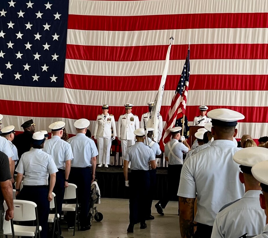 The crew of Coast Guard Tactical Law Enforcement Team South stands at attention during the unit’s change of command ceremony, July 11, 2023, at Coast Guard Air Station Miami. The change of command ceremony marks a transfer of total responsibility and authority from one individual to another. (U.S. Coast Guard photo by Petty Officer 2nd Class Melody Benitez)