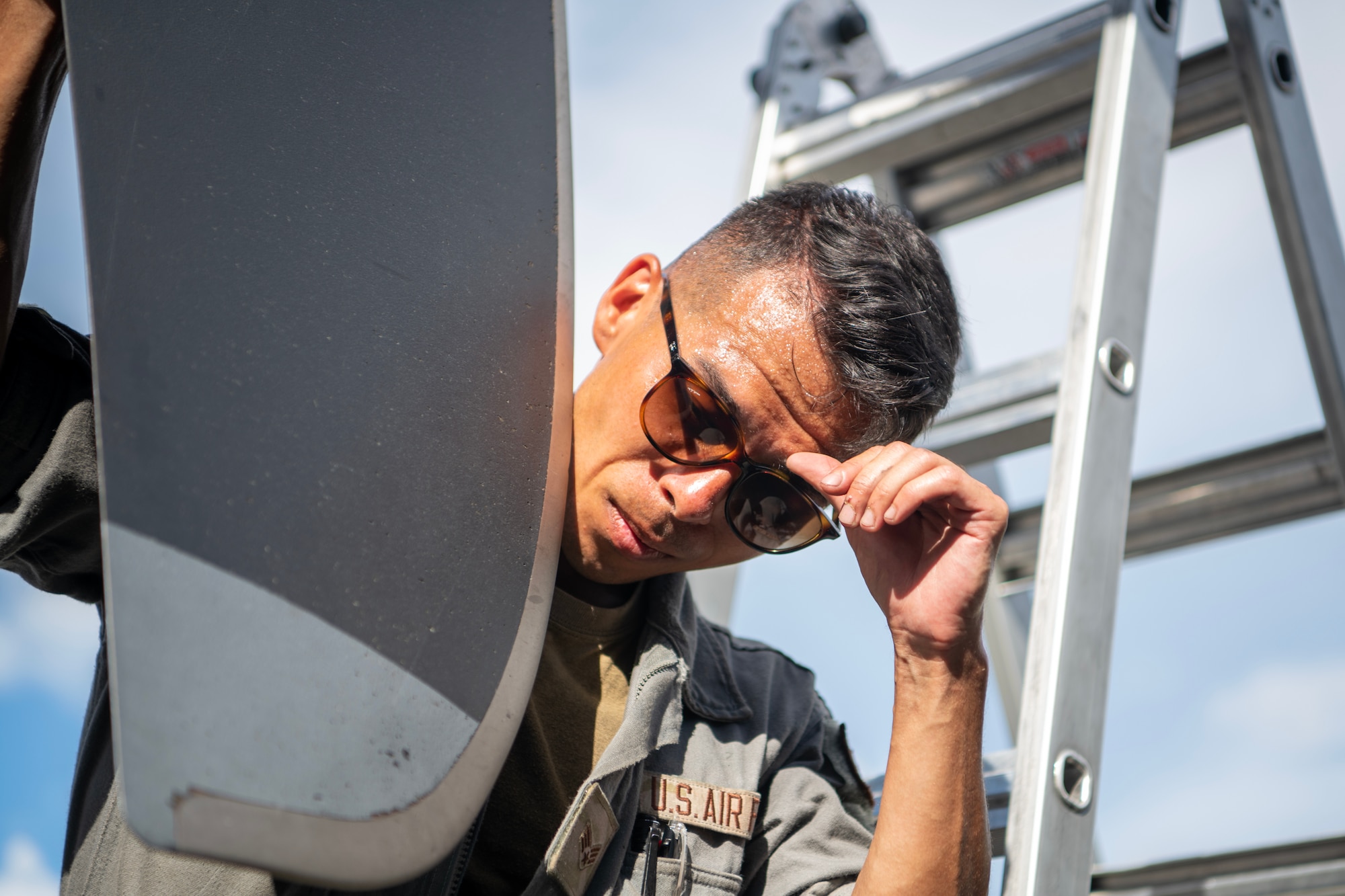 Airmen verifying C-130J propellers for damages after flight