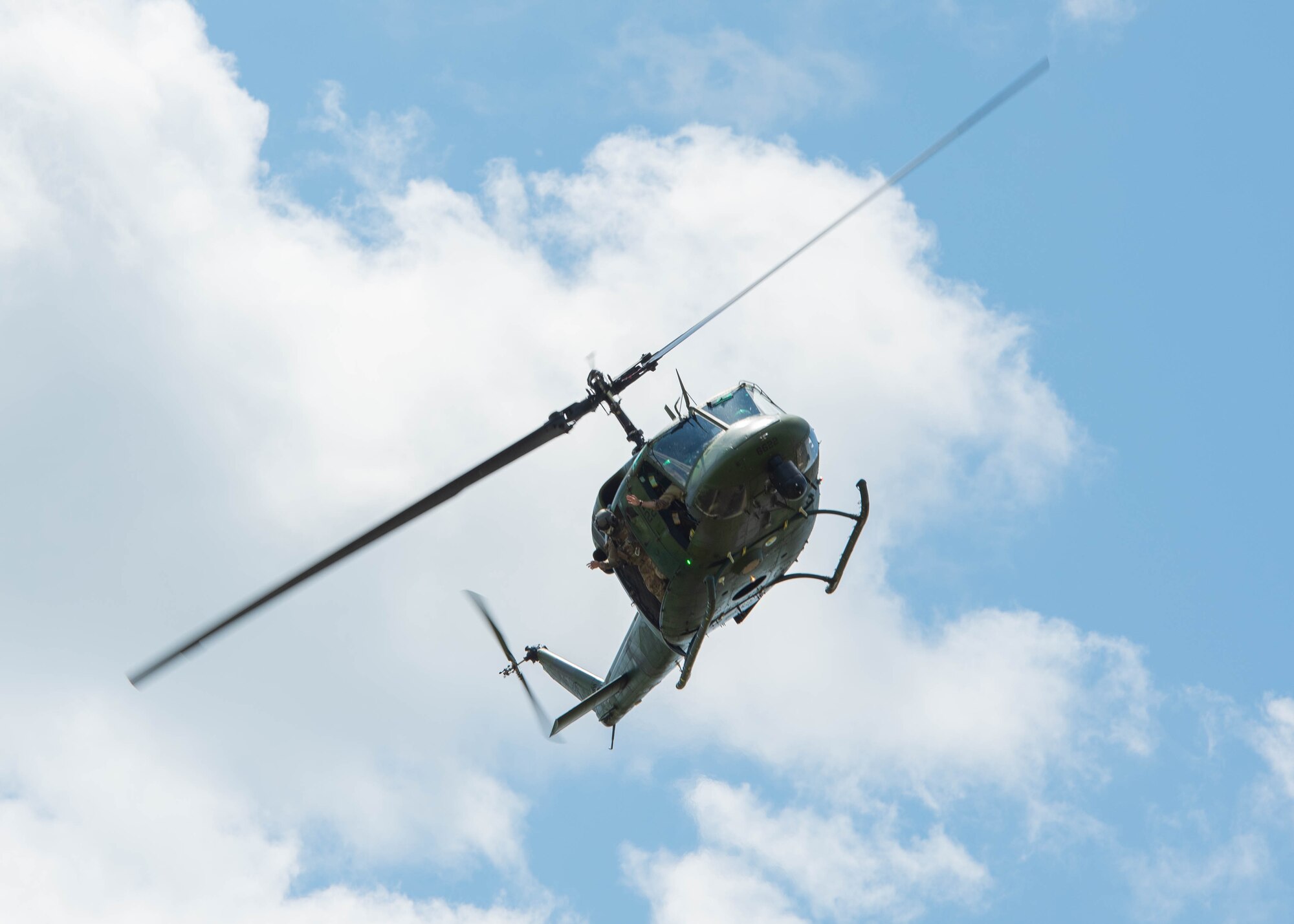 A U.S. Air Force UH-1N Huey assigned to the 54th Helicopter Squadron flies overhead in Mountrail County, North Dakota, July 7, 2023. The 54th Helicopter Squadron can provide tactical response forces to the 91st Missile Wing during launch facility denial, recapture, and convoy operations. (U.S. Air Force photo by Airman 1st Class Kyle Wilson)