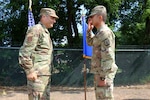 First Lt. Apiwit B. Chulawan, an officer with the Wisconsin Army Naitonal Guard’s 829th Engineer Vertical Construction Company, salutes Maj. Gen. Paul Knapp, Wisconsin’s adjutant general, after being awarded the Soldier’s Medal during a July 9, 2023, ceremony in Spooner, Wis. Chulawan was a passenger on a train that derailed in 2021 and helped aid injured passengers.