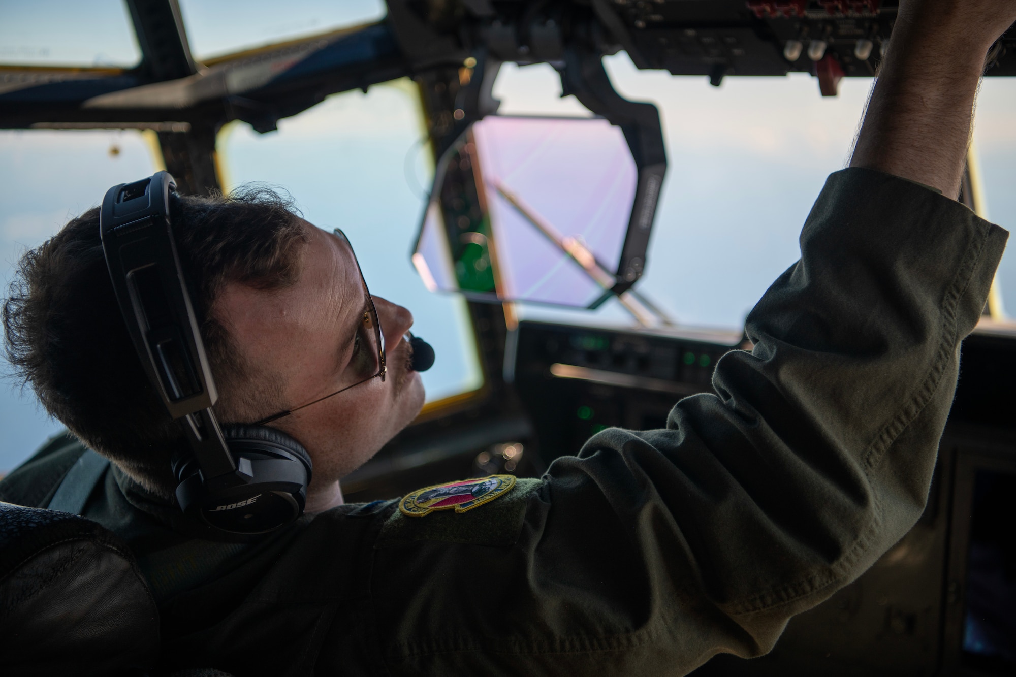C-130J pilot conducting mid-flight checks